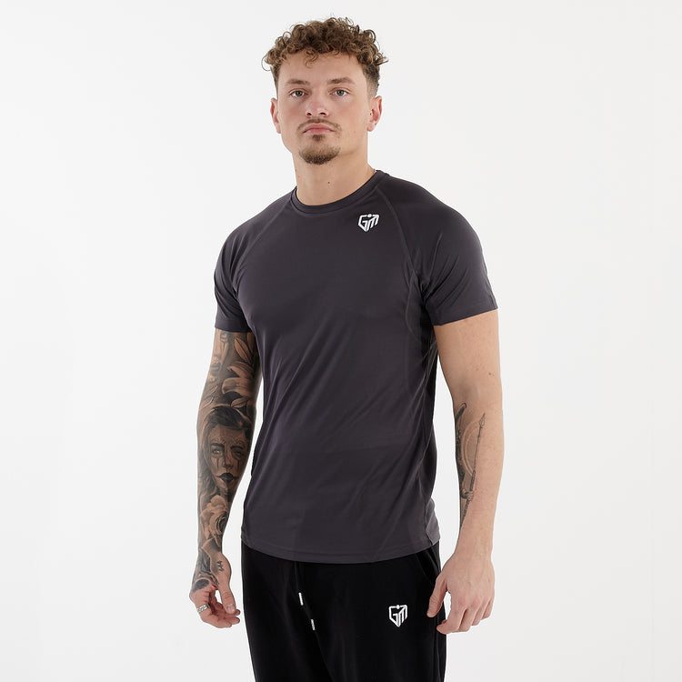 Side view of a man wearing an active panel t-shirt in charcoal