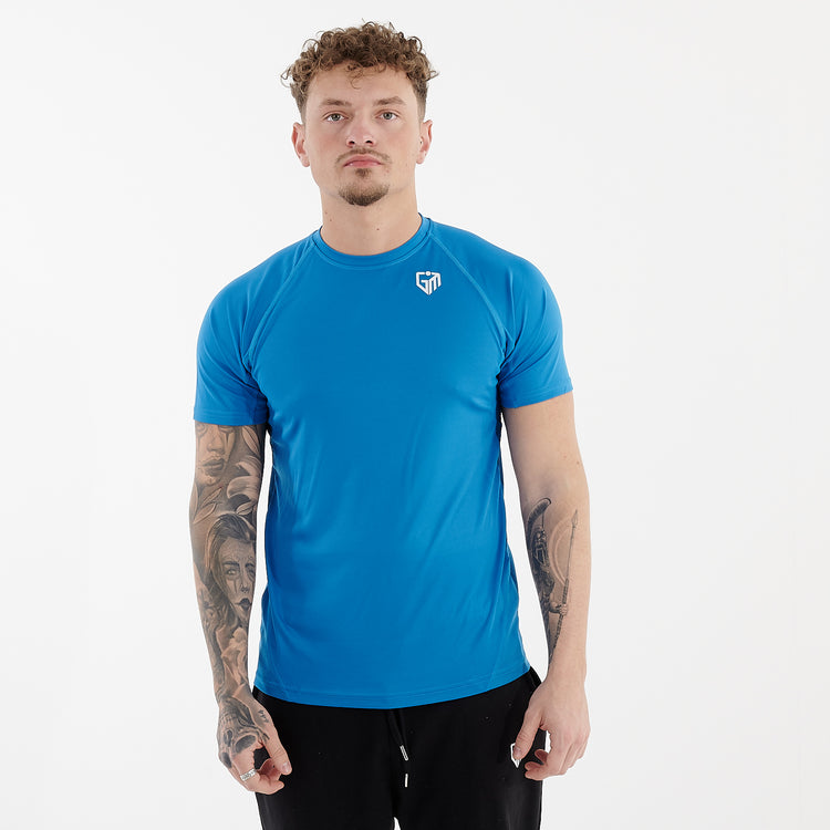 Front view of a man wearing an active panel t-shirt in sapphire