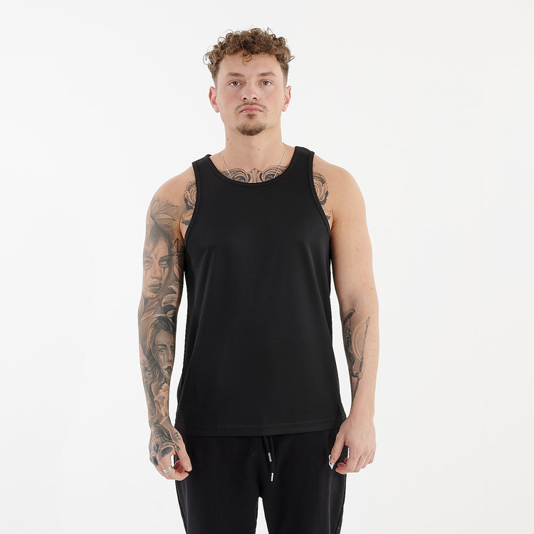 Front view of a man wearing a jet black cool performance vest
