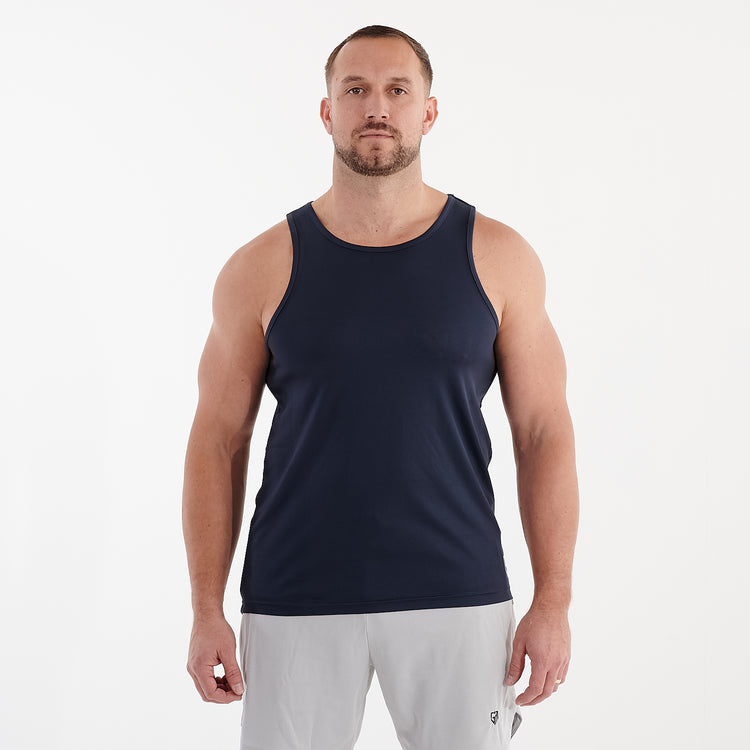 Front view of a man wearing a navy cool performance vest