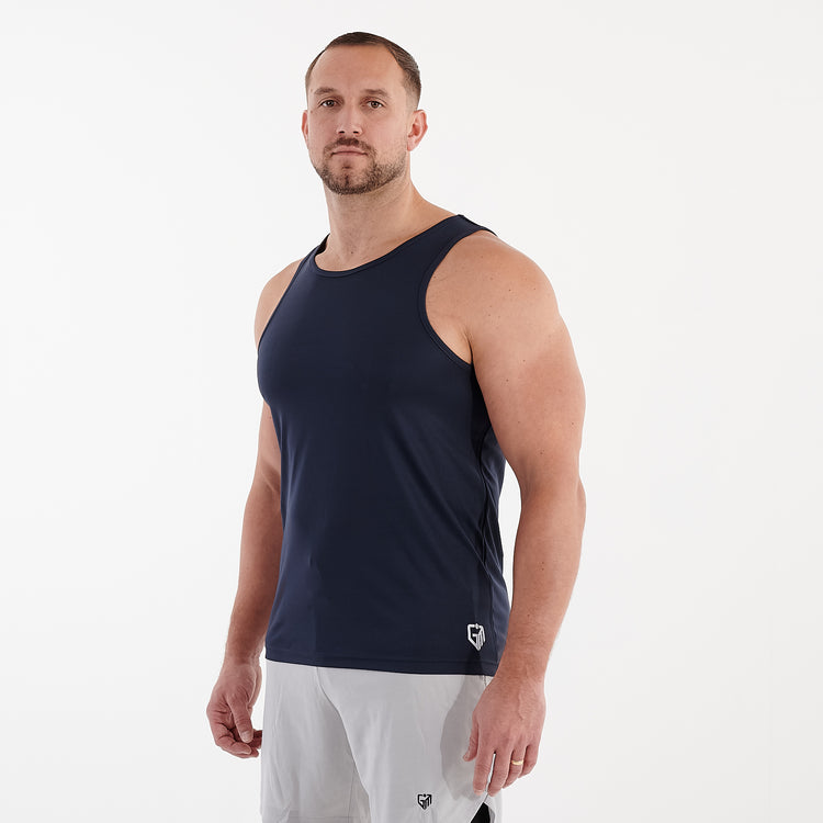 Side view of a man wearing a navy cool performance vest