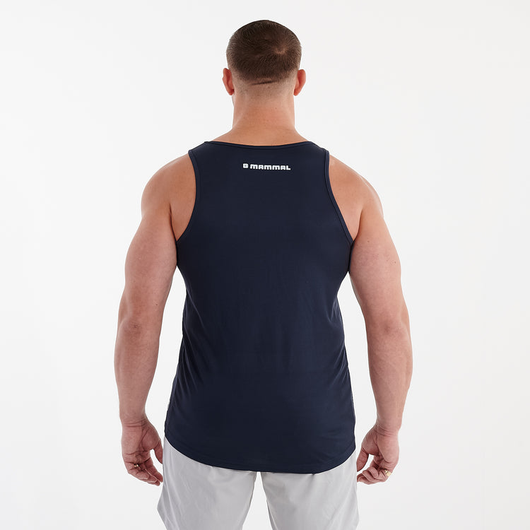 Back view of a man wearing a navy cool performance vest