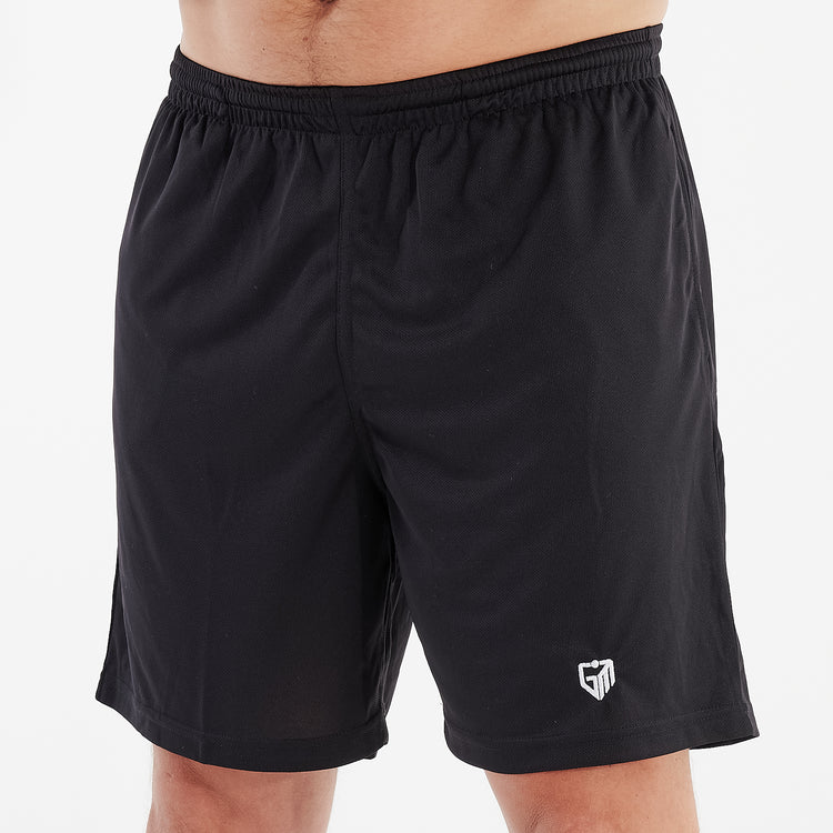Side view of a man wearing jet black cool workout shorts