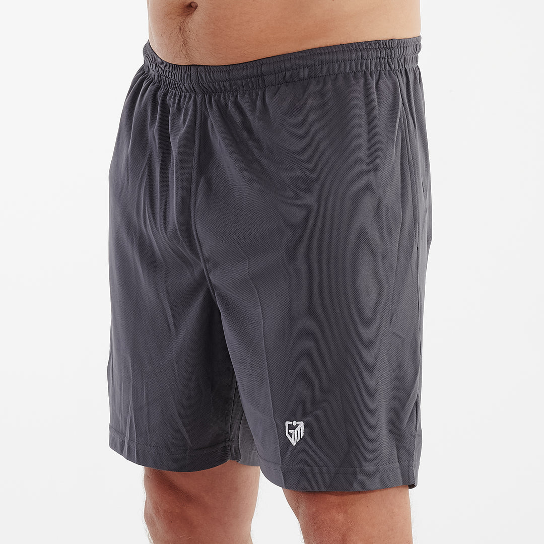 Side view of a man wearing charcoal cool workout shorts
