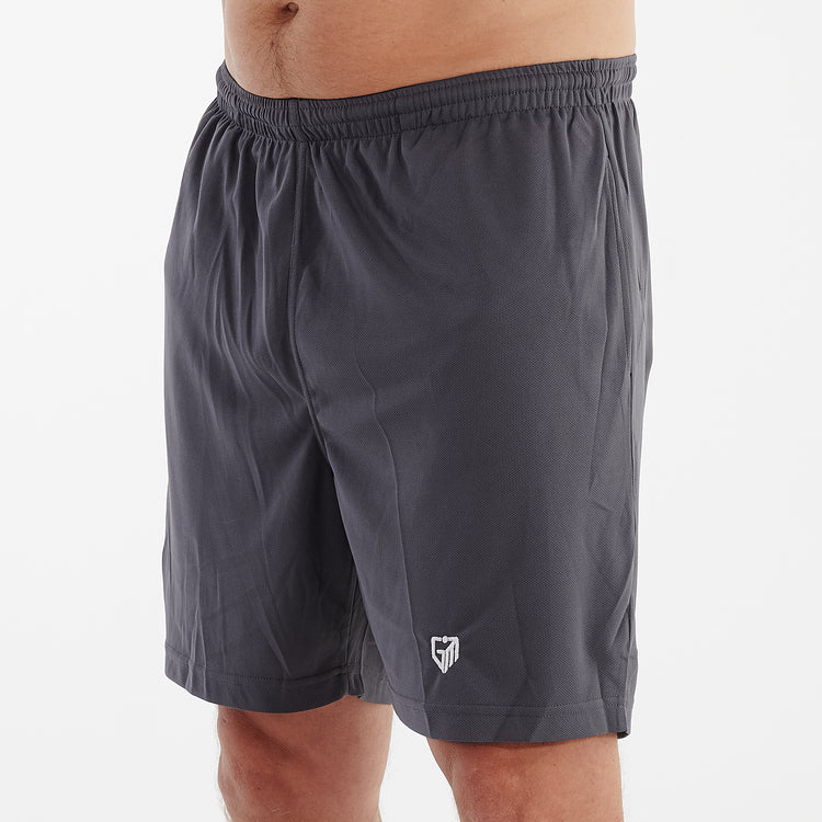 Side view of a man wearing charcoal cool workout shorts