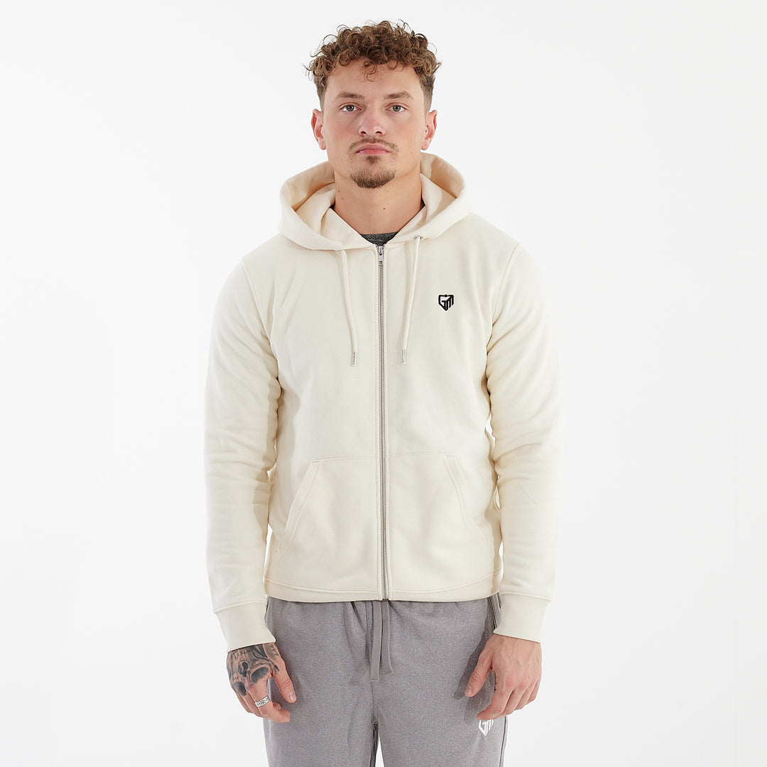 Front view of a man wearing a white cultivator zip through hoodie