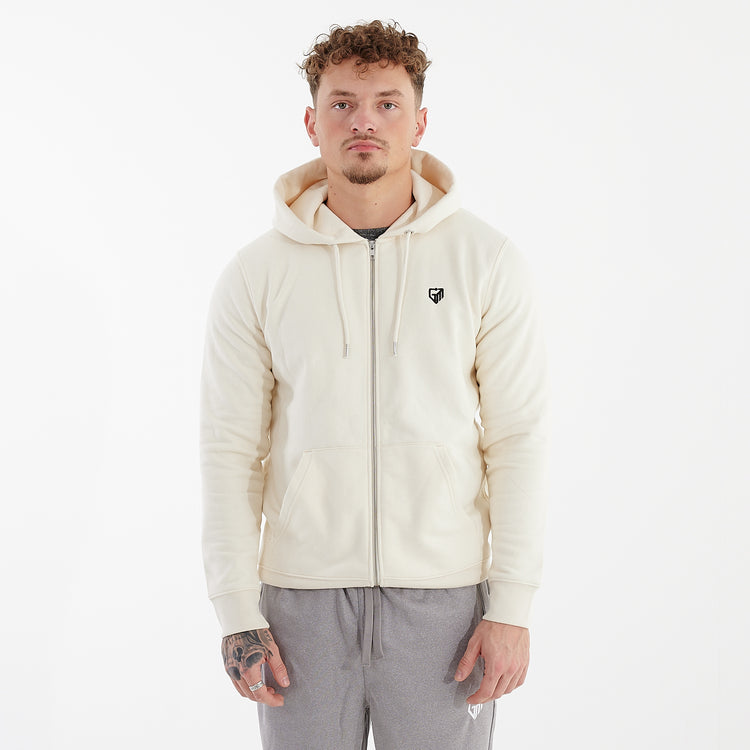Front view of a man wearing a white cultivator zip through hoodie