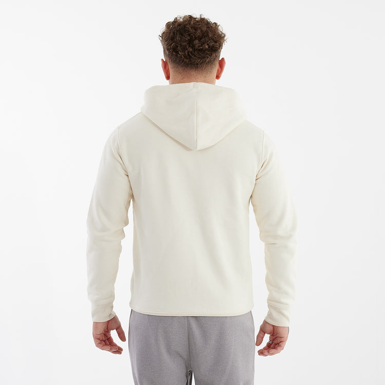 Back view of a man wearing a white cultivator zip through hoodie