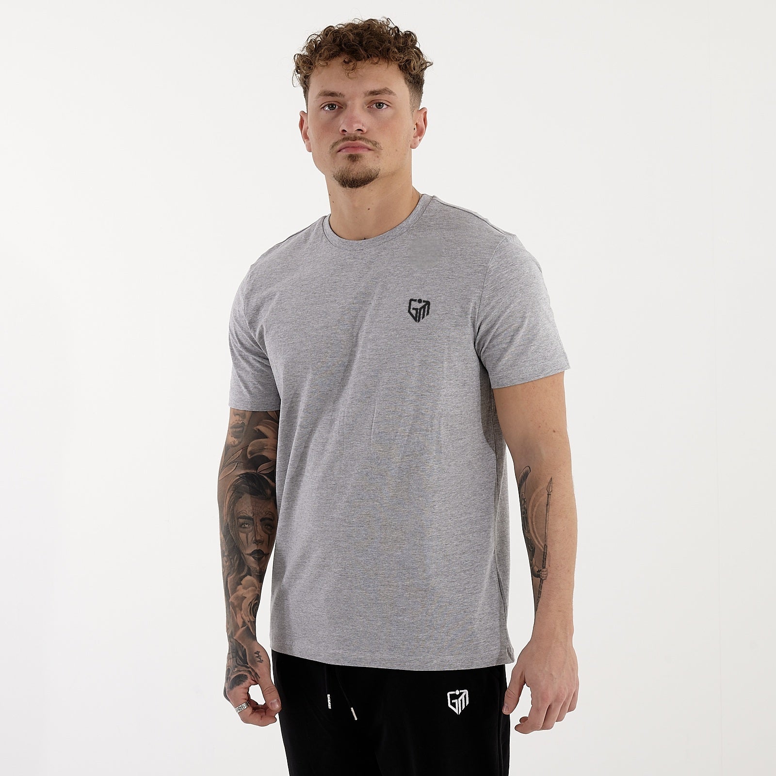 Side view of a man wearing a organic t-shirt in heather grey