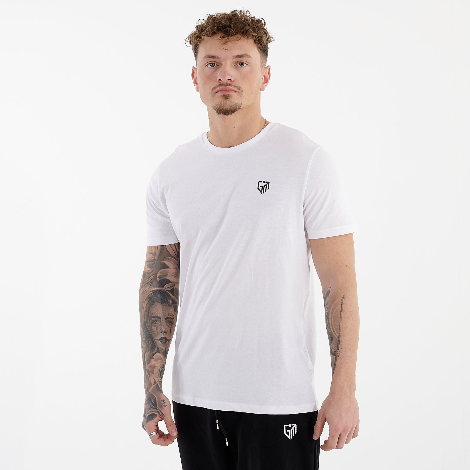 Side view of a man wearing a white organic everyday t-shirt