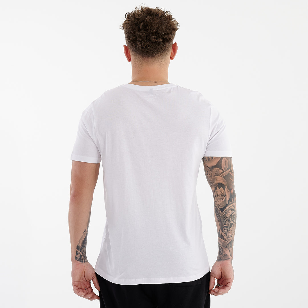 Back view of a man wearing a white organic everyday t-shirt