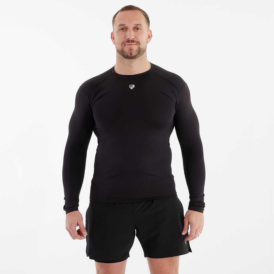 Front view of a man wearing a black performance baselayer 