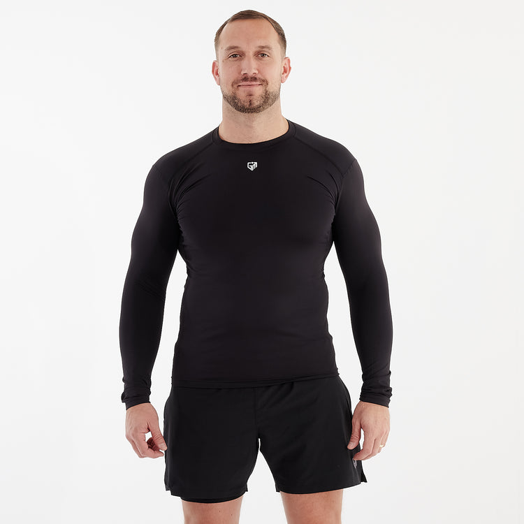Front view of a man wearing a black performance baselayer 