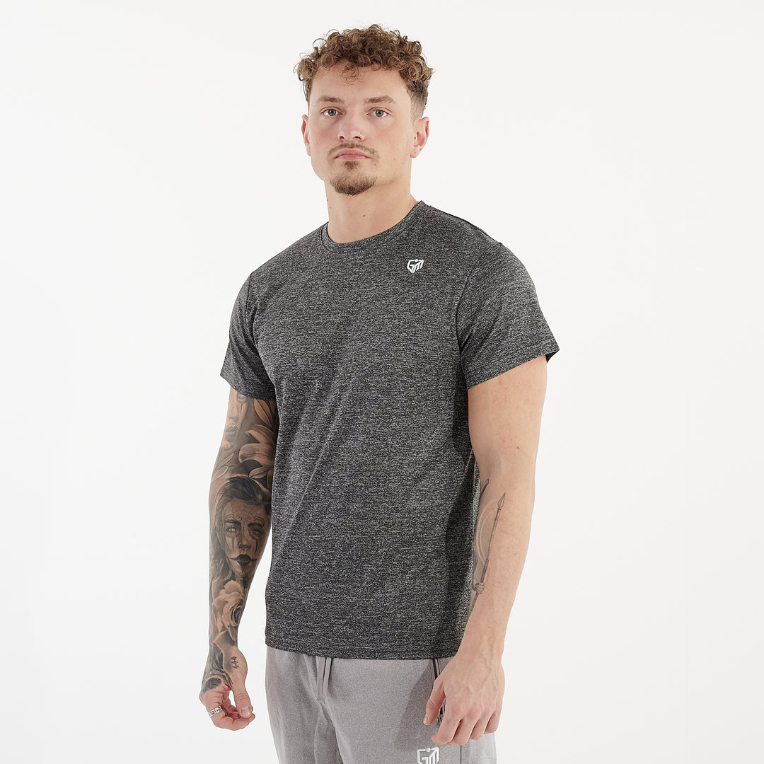 Side view of a man wearing a asphalt performance recycled tee