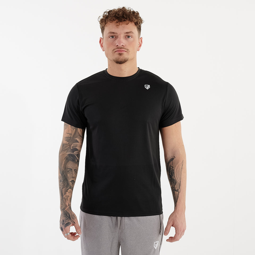 Front view of a man wearing a black performance recycled tee
