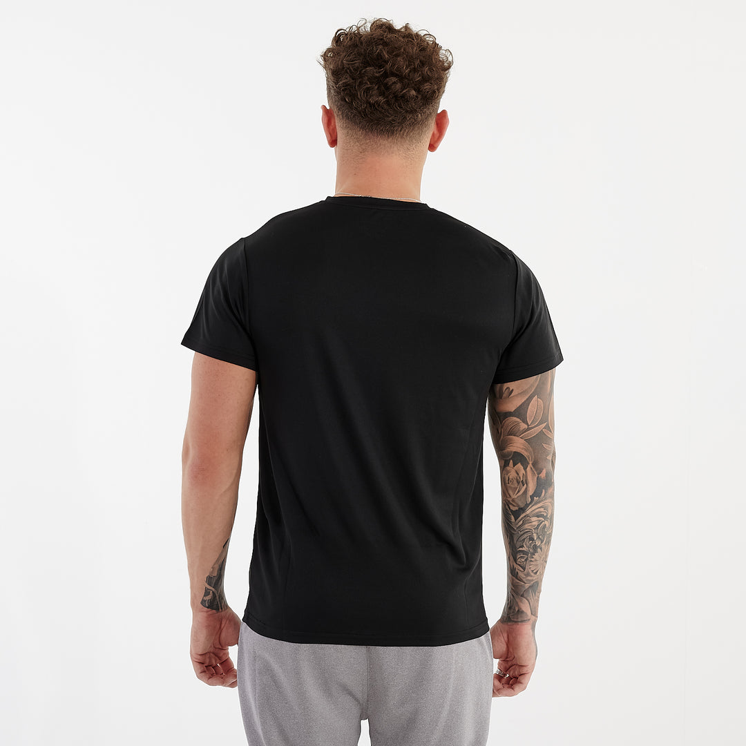 Back view of a man wearing a black performance recycled tee