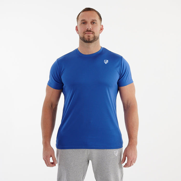 Front view of a man wearing a blue performance recycled tee.