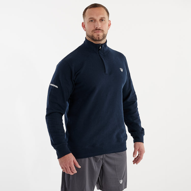 Side view of a man wearing a 1/4 zip navy sweatshirt
