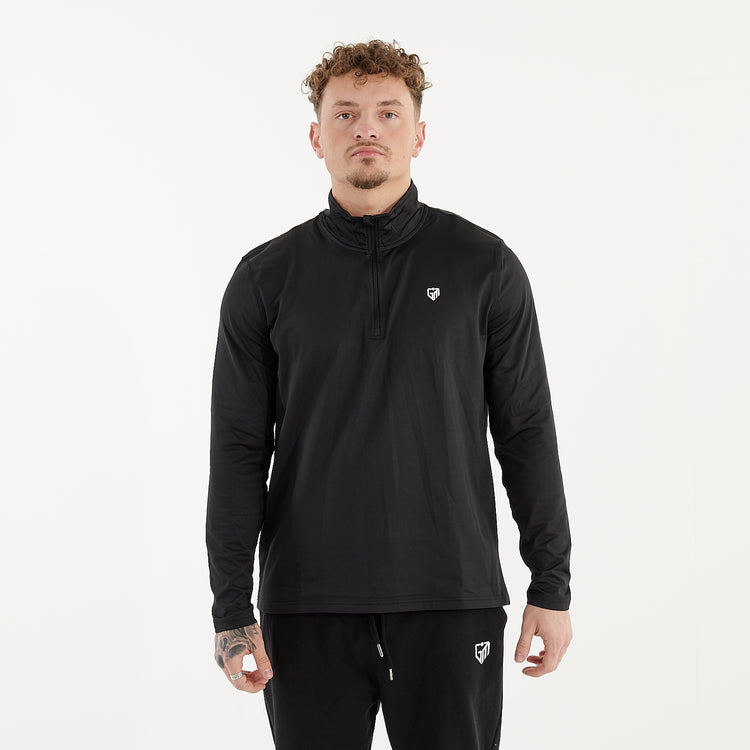 Front view of a man wearing a recycled brushed 1/4 Zip Training Top in French Navy and White