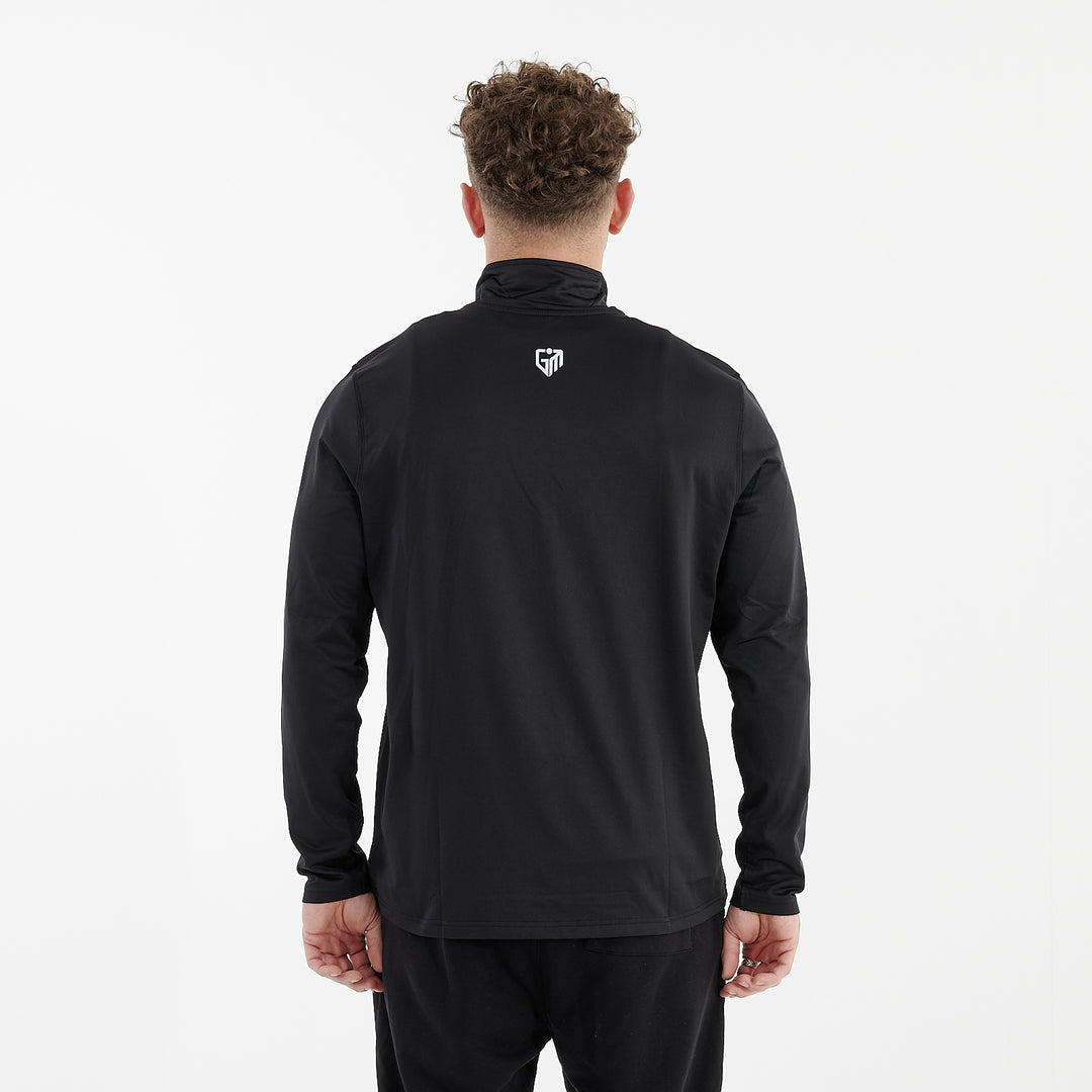 Back view of a man wearing a recycled brushed 1/4 Zip Training Top in French Navy and White