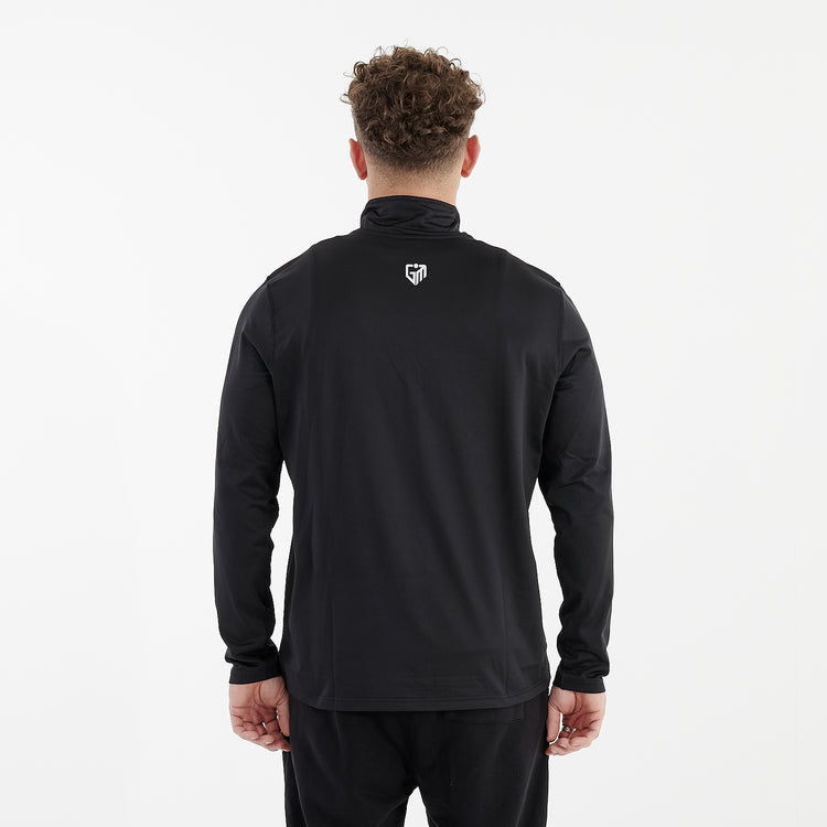 Back view of a man wearing a recycled brushed 1/4 Zip Training Top in French Navy and White