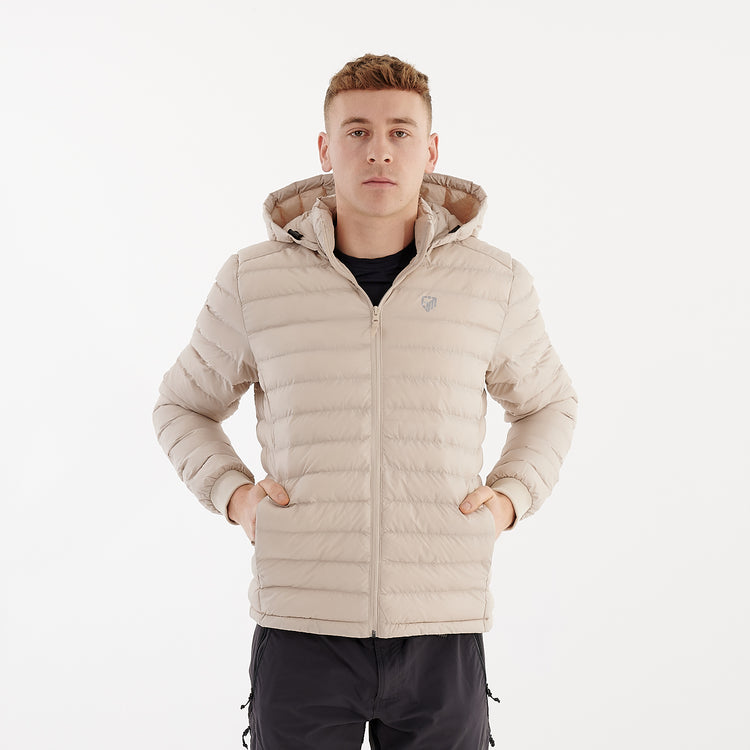 Front view of a man wearing a recycled lightweight jacket in desert dust