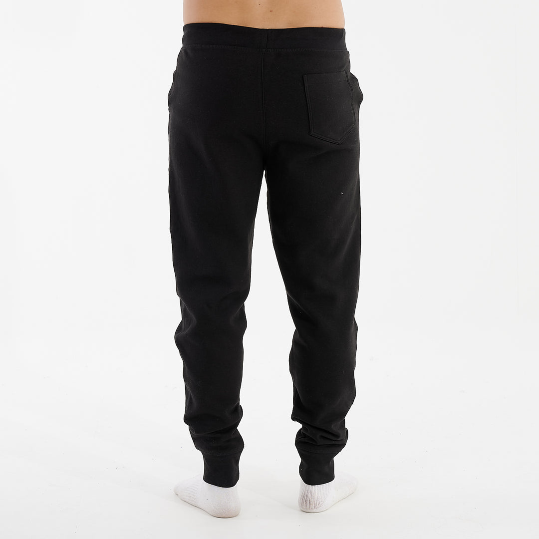 Back view of a man wearing black slim cuffed joggers