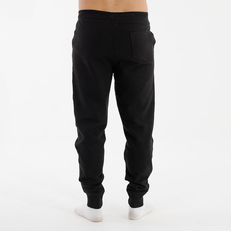 Back view of a man wearing black slim cuffed joggers