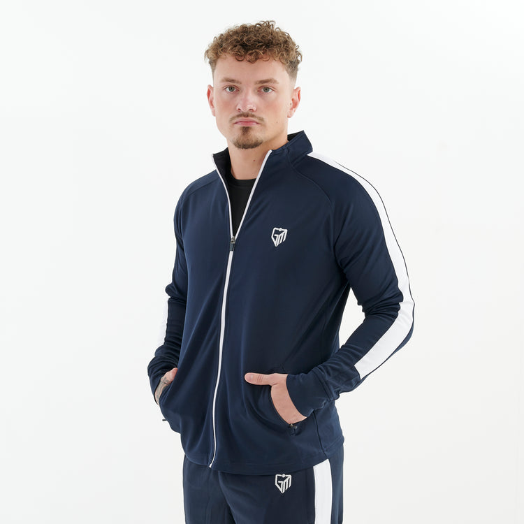 Side view of a man wearing a slim fit knitted tracksuit top in navy/white