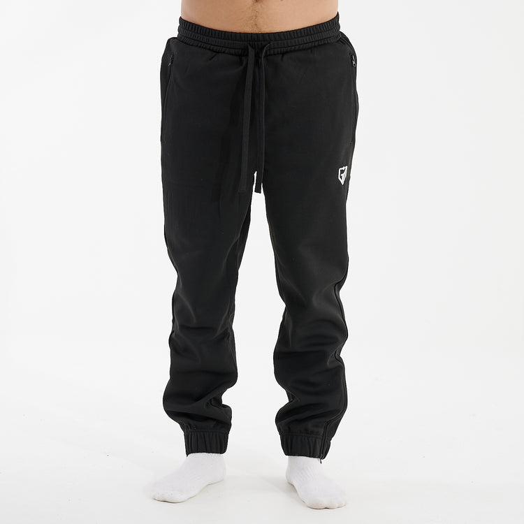 Front view of a man wearing sustainable knit joggers in black