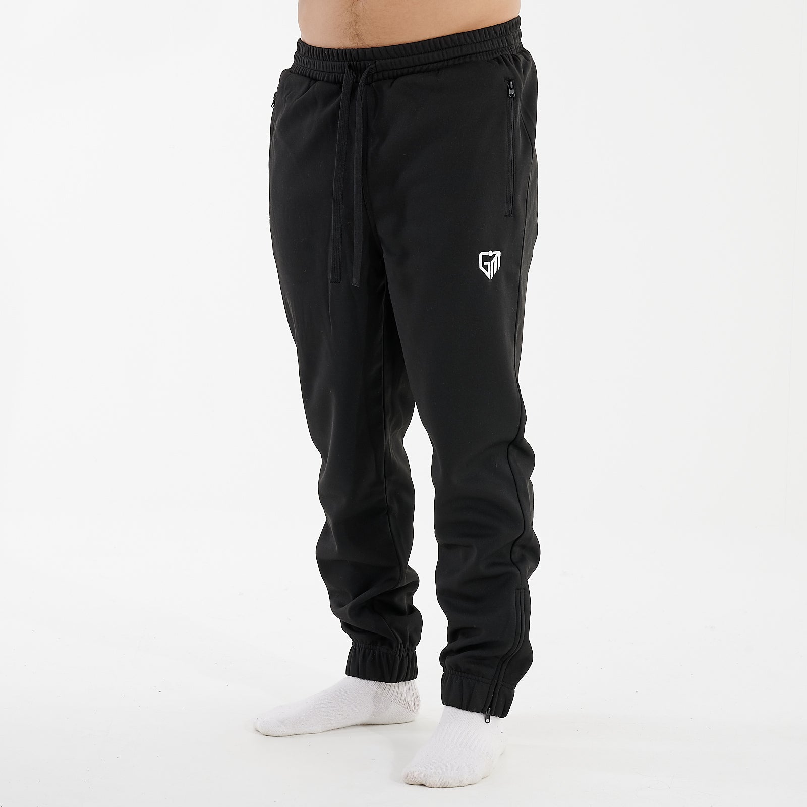 Side view of a man wearing sustainable knit joggers in black