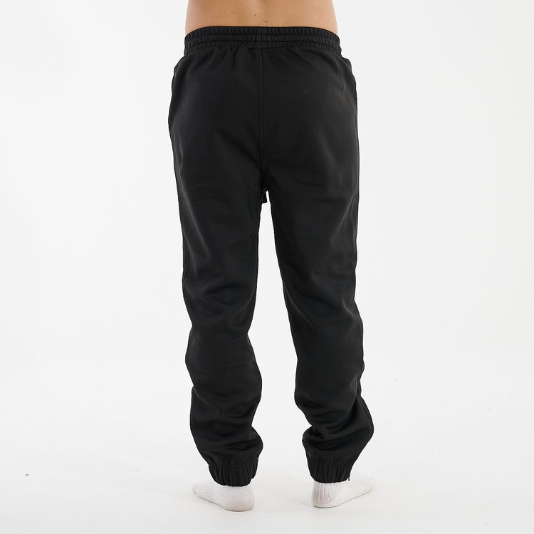 Back view of a man wearing sustainable knit joggers in black