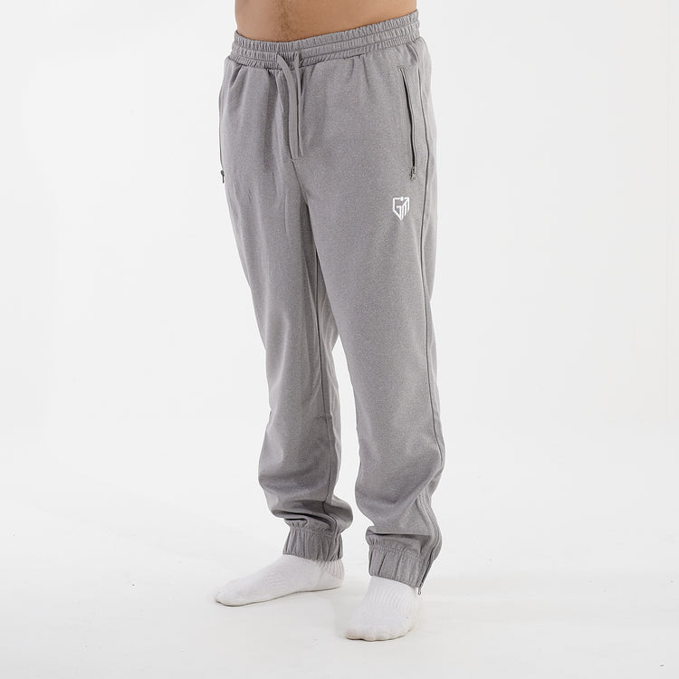 Side view of a man wearing grey sustainable knit joggers