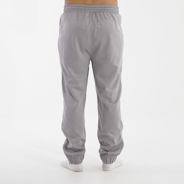 Back view of a man wearing grey sustainable knit joggers
