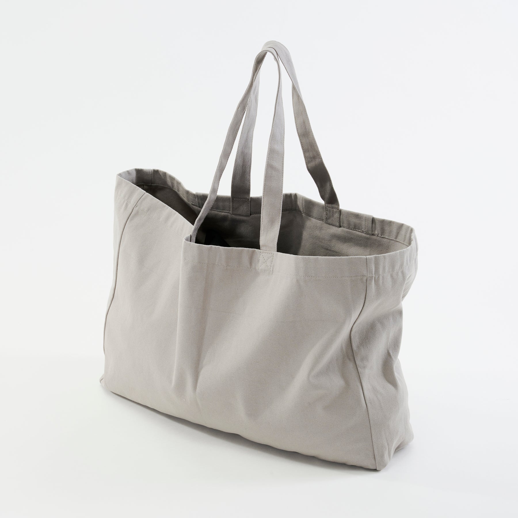 Side view, the organic canvas organic yoga carrier, highlighting its size and shape.