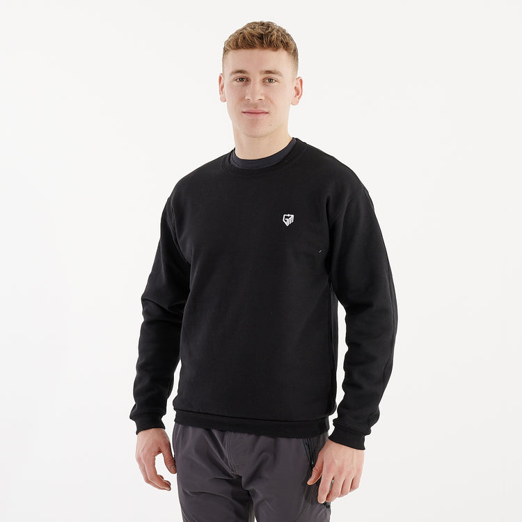 Side view of a man wearing a black crewneck sweatshirt