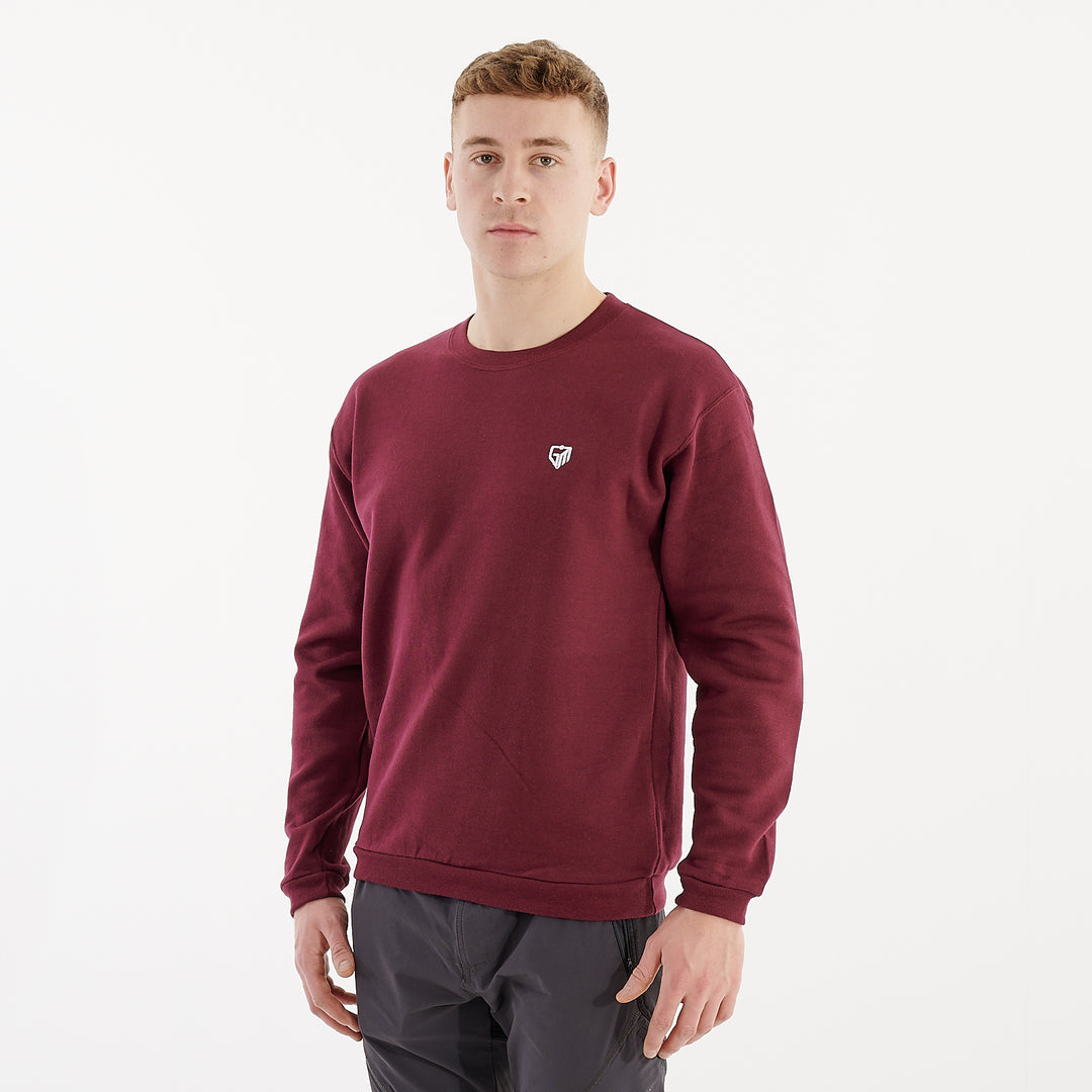 Side view of a man wearing a burgundy crewneck sweatshirt