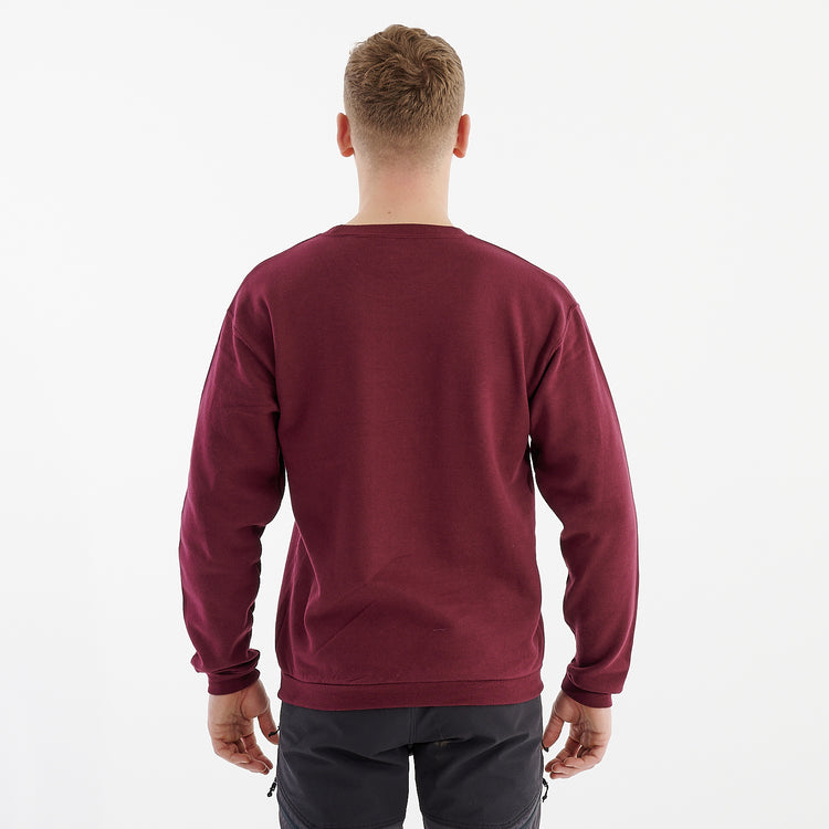 Back view of a man wearing a burgundy crewneck sweatshirt