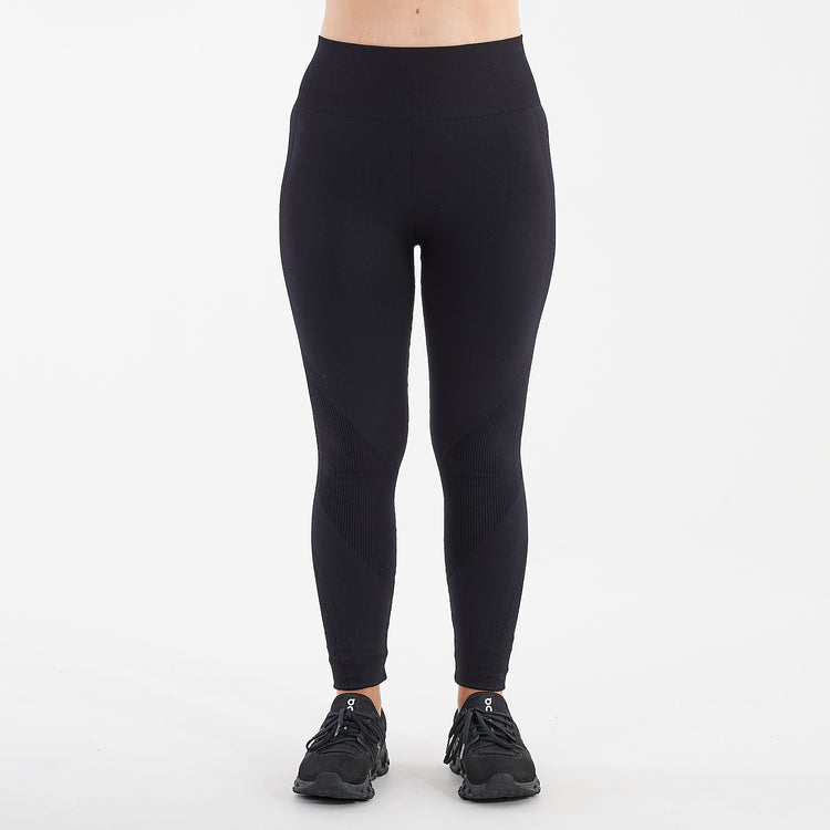 Front view of a woman wearing black sculpt fit multi sport leggings