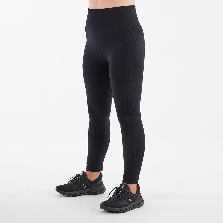 Side view of a woman wearing black sculpt fit multi sport leggings