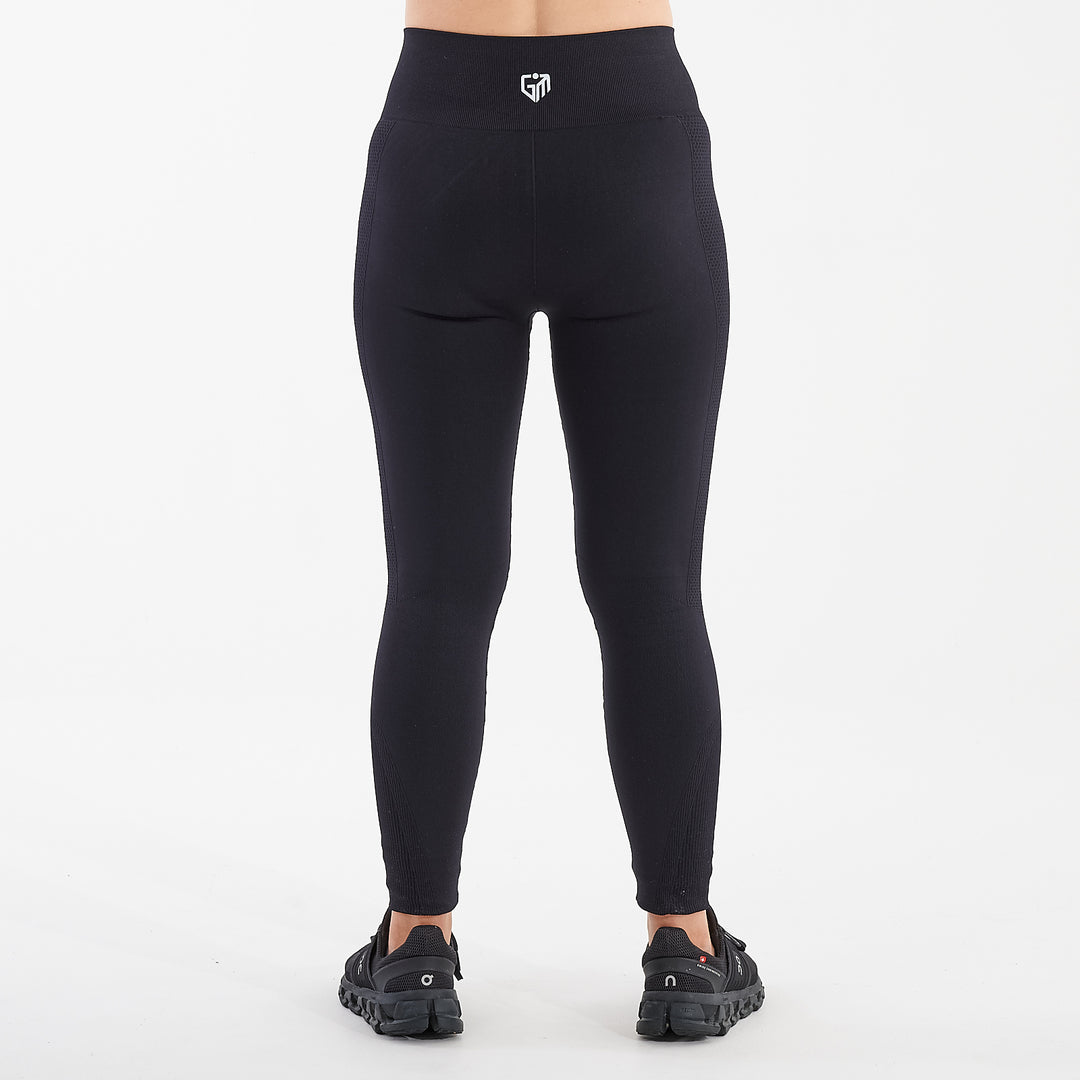 Back view of a woman wearing black sculpt fit multi sport leggings