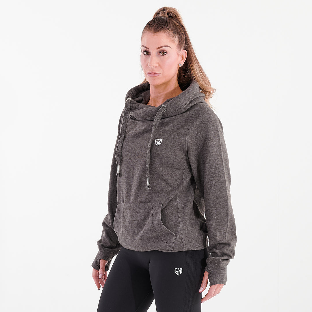 Side view of a woman wearing a charcoal heavyweight cross neck hoodie