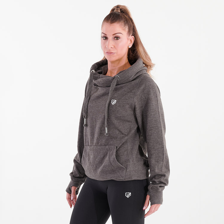 Side view of a woman wearing a charcoal heavyweight cross neck hoodie