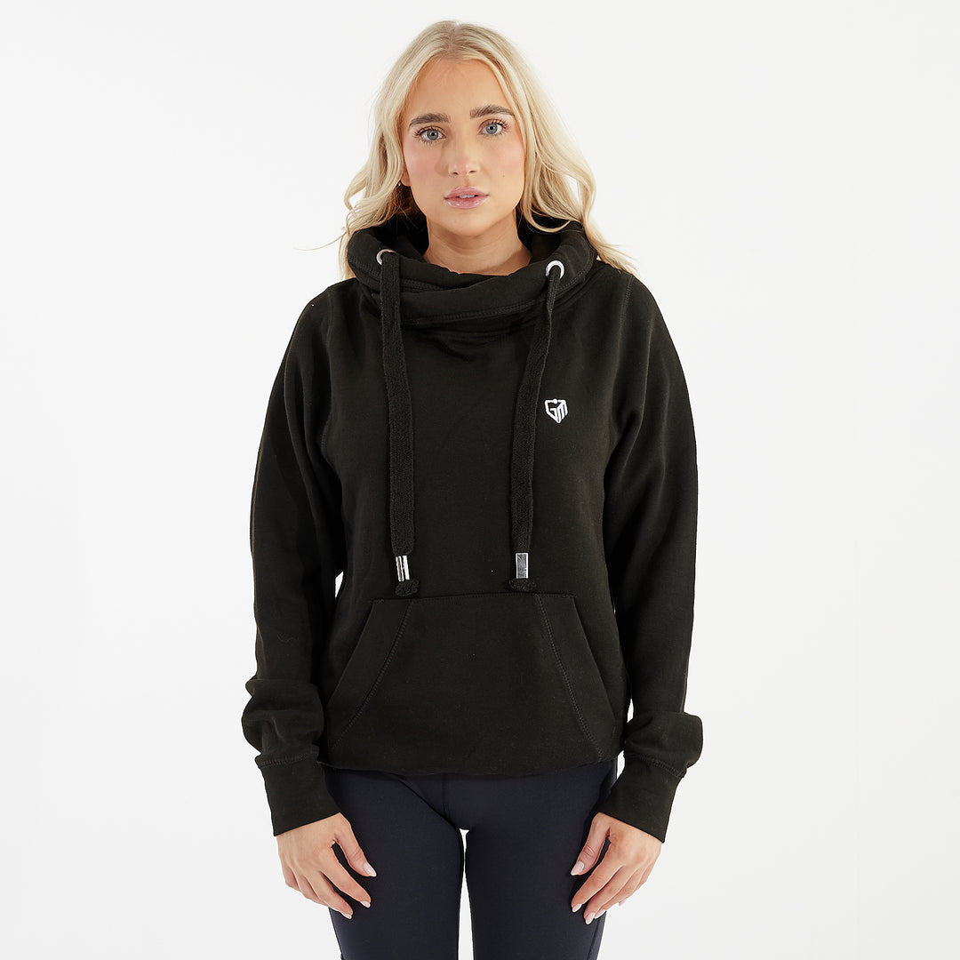 Front view of a woman wearing a black heavyweight cross neck hoodie