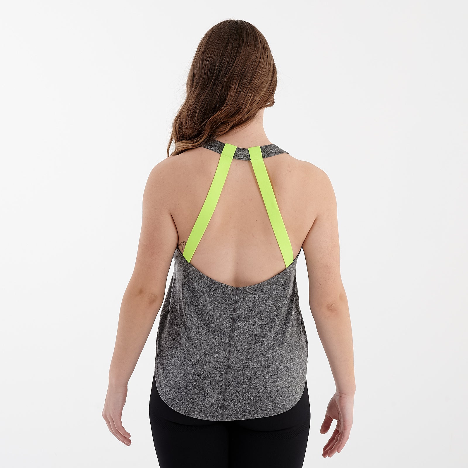 Back view of a woman wearing a grey melange strappy back performance vest.