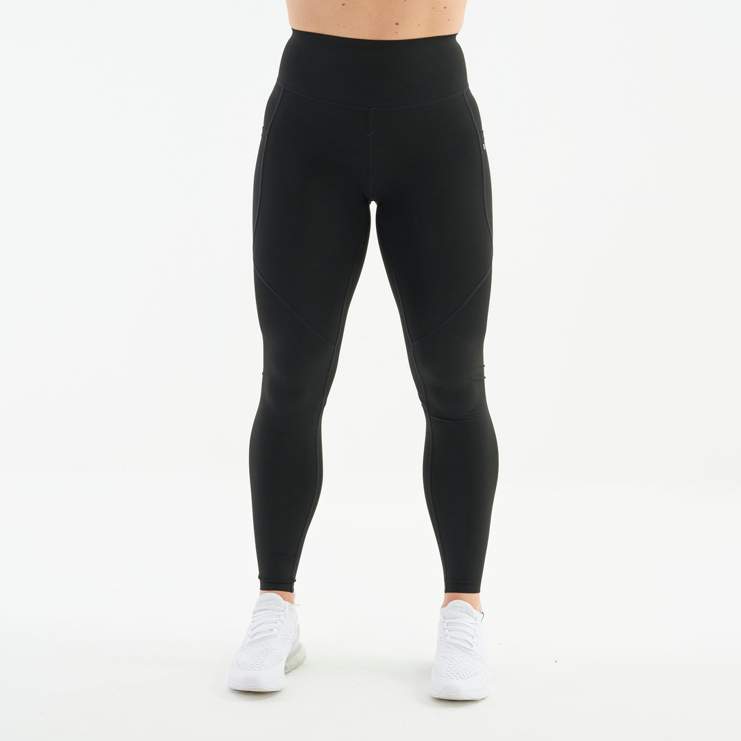Front view of a woman wearing black hourglass sculpt leggings