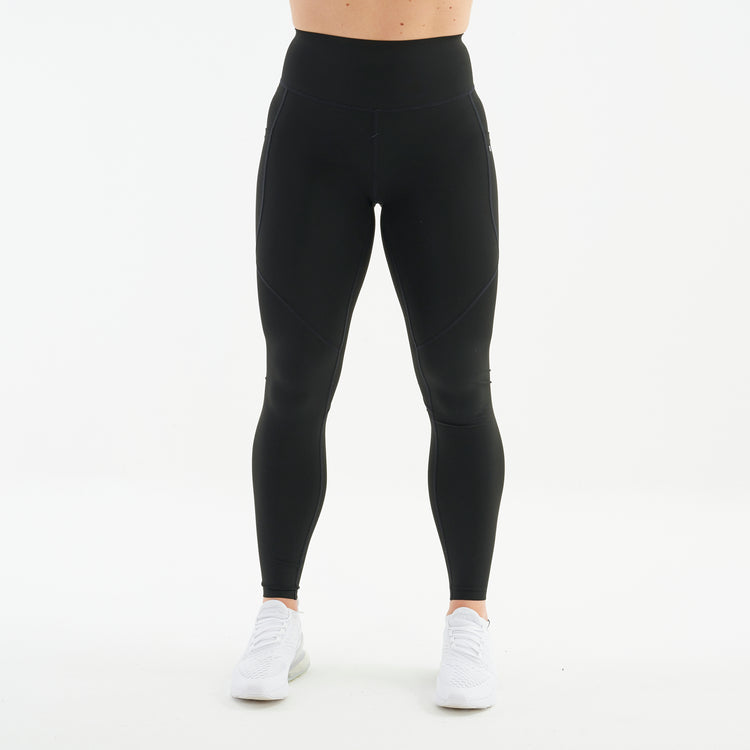 Front view of a woman wearing black hourglass sculpt leggings