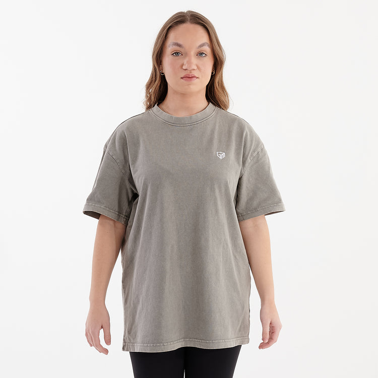 Front view of a woman wearing an oversized acid wash t-shirt asphalt