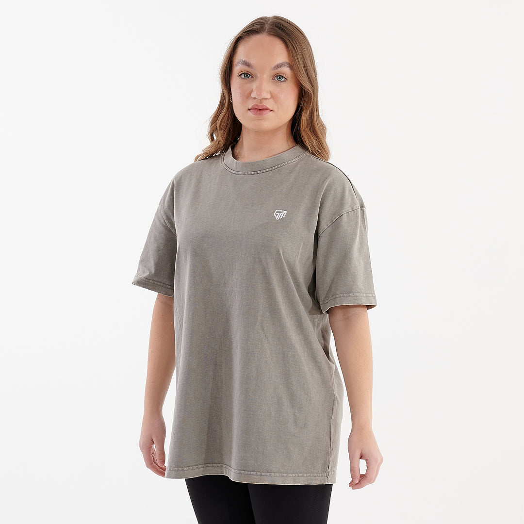 Side view of a woman wearing an oversized acid wash t-shirt asphalt