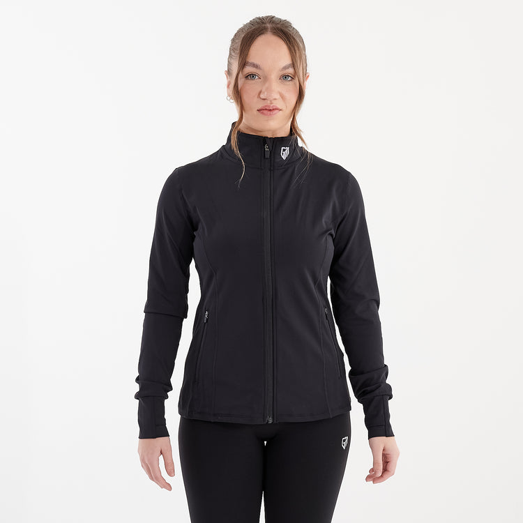 Front view of a woman wearing a black recycled fitness jacket